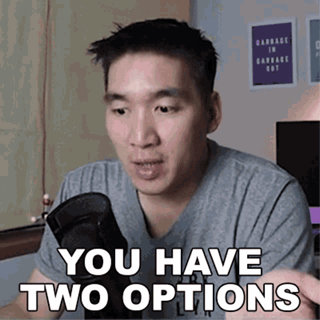 a man is talking into a microphone and says you have two options .