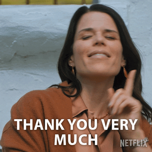 a woman says " thank you very much " with her finger up