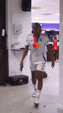 a female soccer player wearing a white jersey with the number 17 on it