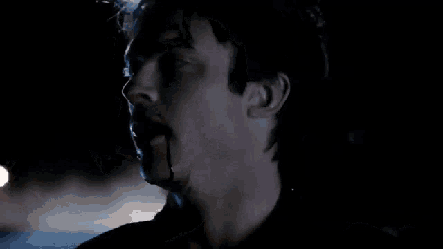 a vampire with blood dripping from his mouth