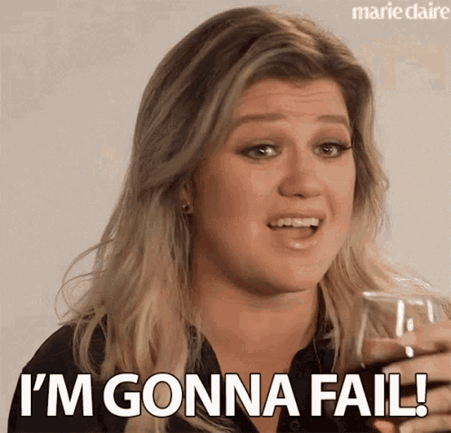 a woman is holding a wine glass and saying i 'm gonna fail .