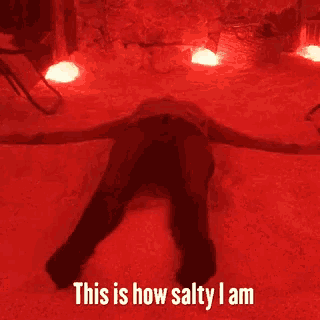 a person laying on their back with the words " this is how salty i am " on the bottom