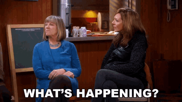 two women sitting next to each other with the words what 's happening