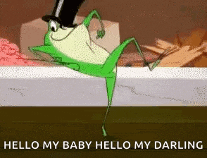 a frog wearing a top hat is dancing on a bed .