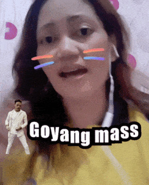 a woman wearing ear buds says goyang mass in front of a man