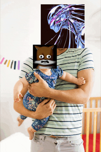 a man is holding a baby in his arms with a picture of a cat covering his face