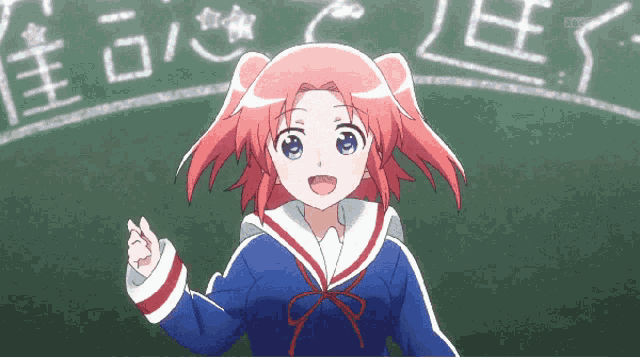 a girl with red hair is standing in front of a blackboard that says abc on it
