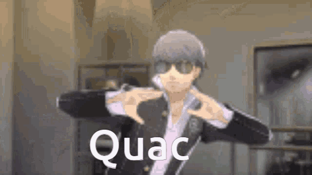a man wearing sunglasses is making a heart shape with his hands and the word quac is on the bottom .