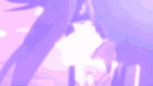 a purple background with a glowing object in the middle of it