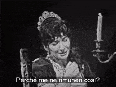a woman sitting in front of a candle with the words perche me ne rimuneri cosi below her