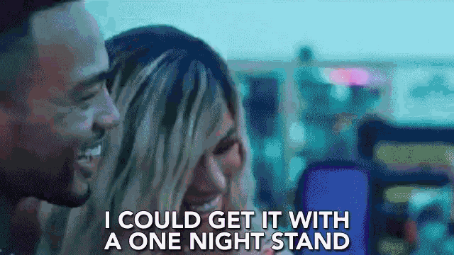a man and a woman are looking at a cell phone with the words i could get it with a one night stand below them