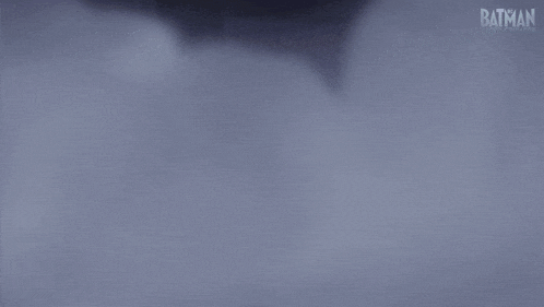 a cartoon of batman standing in a foggy area