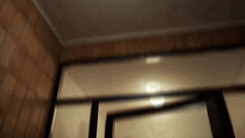 a blurry picture of a door with a light shining through it