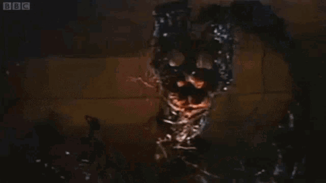 a close up of a monster 's face with bbc written on the bottom