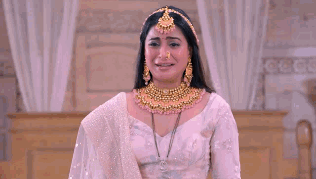 a woman in a white dress is crying with the words zindagi barbaad ho gayi