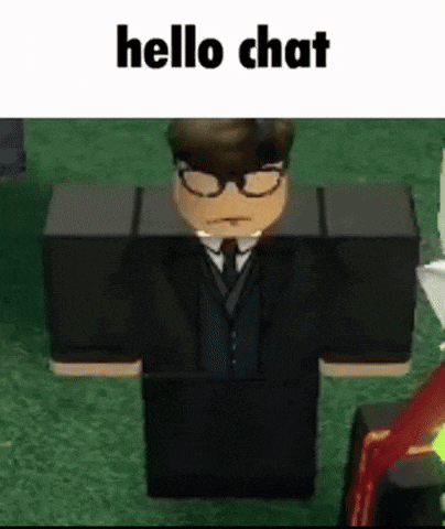 a roblox character in a suit and tie is standing in the grass and talking to someone .