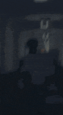 a blurred image of a person walking down a hallway with the letters cc visible