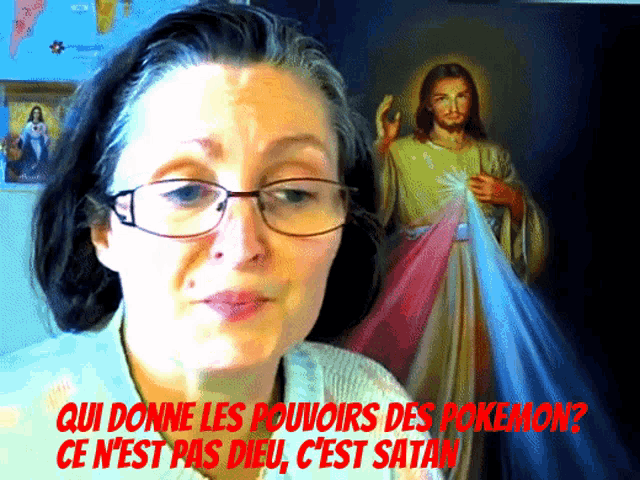 a woman wearing glasses is standing in front of a painting of jesus