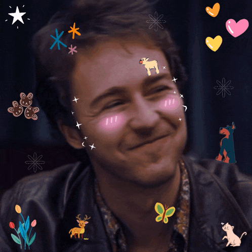 a man with stickers on his face including hearts and stars