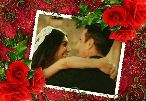a picture of a bride and groom with red roses in the background