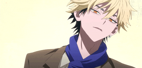 a close up of a person 's face with yellow hair and orange eyes
