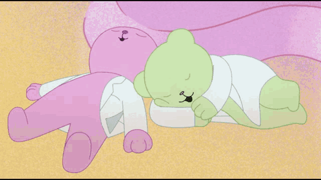 a pink and green cartoon character laying next to each other on the ground