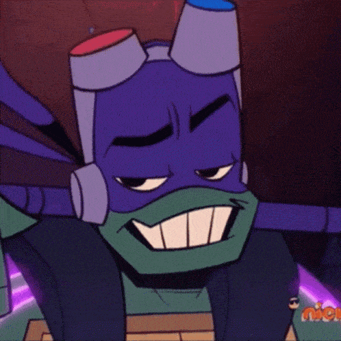 a close up of a teenage mutant ninja turtle wearing goggles and making a funny face .