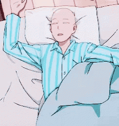 a man in a blue and white striped shirt is sleeping on a bed with his arms outstretched .