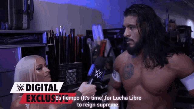 a woman is talking to a wrestler with a digital exclusive advertisement