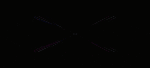 a dark background with a purple and blue light coming out of it
