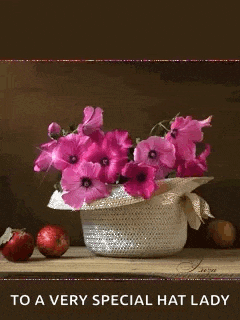 a picture of pink flowers in a hat with the words to a very special hat lady