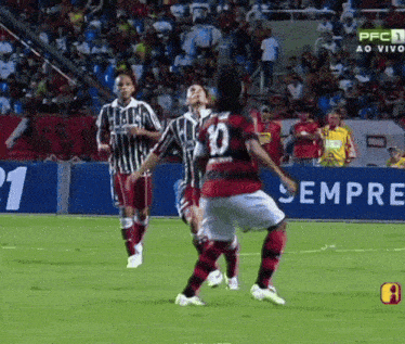 a soccer player wearing a number 10 jersey is kicking the ball
