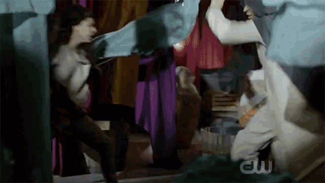 a group of people are dancing in a room with a cw logo on the bottom
