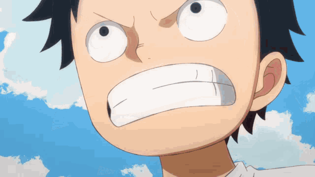 a close up of a person 's face with a blue sky behind them