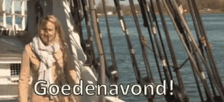 a woman is standing on a boat in the water with the words goedeavond !