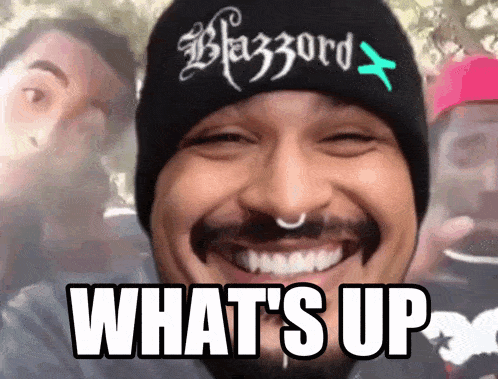 a man wearing a beanie that says blazord on it