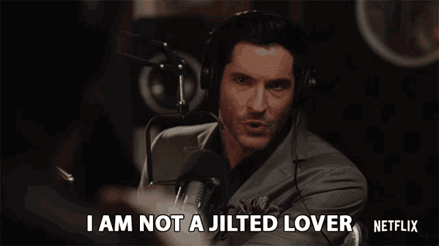 a man wearing headphones says i am not a jilted lover