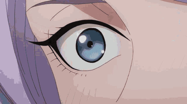 a close up of a woman 's blue eye