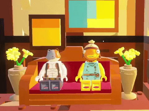 two lego figures are sitting on a couch next to each other
