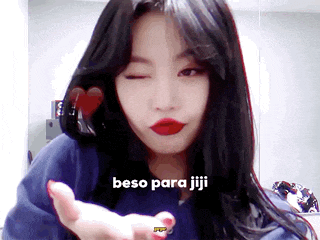 a close up of a woman 's face with the words beso para jiji written on the bottom