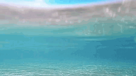 a computer generated image of a beach with the sun shining on the water