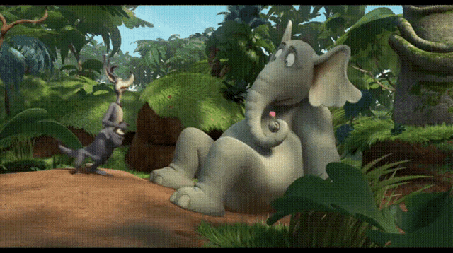 a cartoon elephant is laying down in the jungle with a rabbit standing next to it