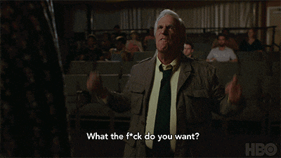 a man in a suit and tie says " what the fuck do you want "