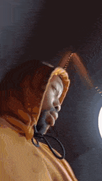 a close up of a person wearing a hoodie