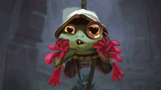 a frog wearing a hat and red gloves has a heart in its eyes