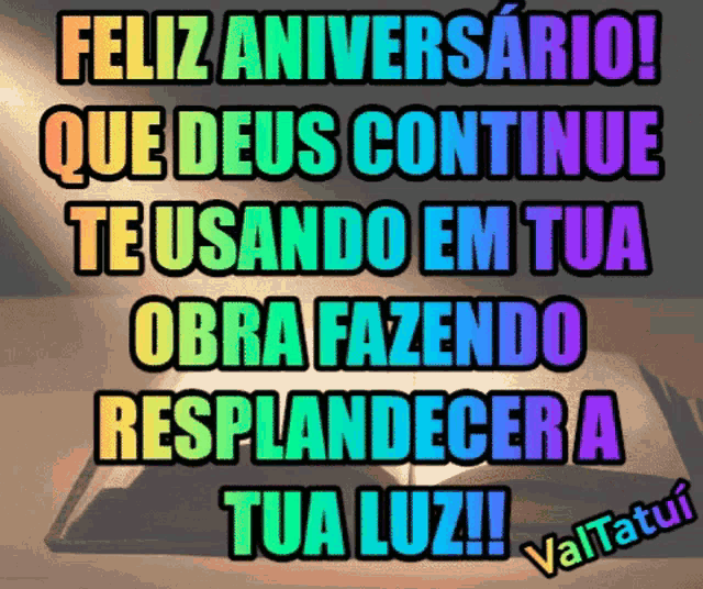 a rainbow colored sign that says " feliz aniversario "