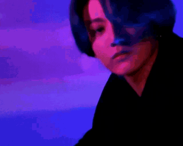 a shadow of a person is projected onto a blue wall