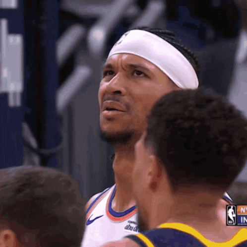 a basketball player wearing a headband that says ' nba in ' on it