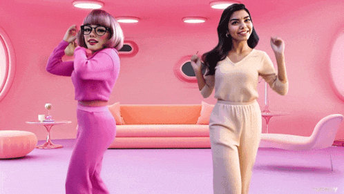 two women are dancing in a pink room with a couch