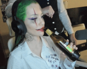 a woman in a joker costume is drinking from a bottle of beer